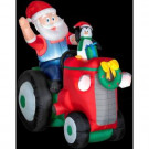 5.5 ft. Animated Inflatable Santa with Penguin on Tractor